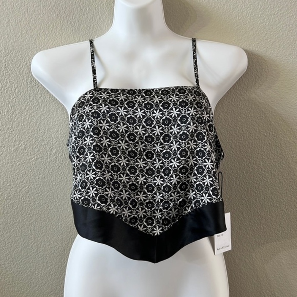 Black and white floral print crop top. Straps are adjustable size medium